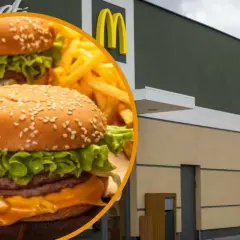 Cheeseburger i frytki na tle budynku McDonald's.