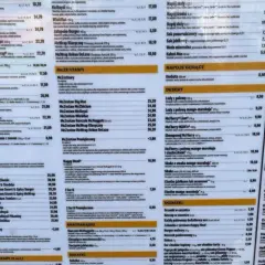 Menu z cenami, w tym Happy Meal za 16,90 zł. Znajdziesz tu burgery, McWrap, McZestawy i desery.